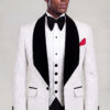 Three-quarter view of a white damask jacket and matching four-button vest with black trousers from Gentleman's Guru
