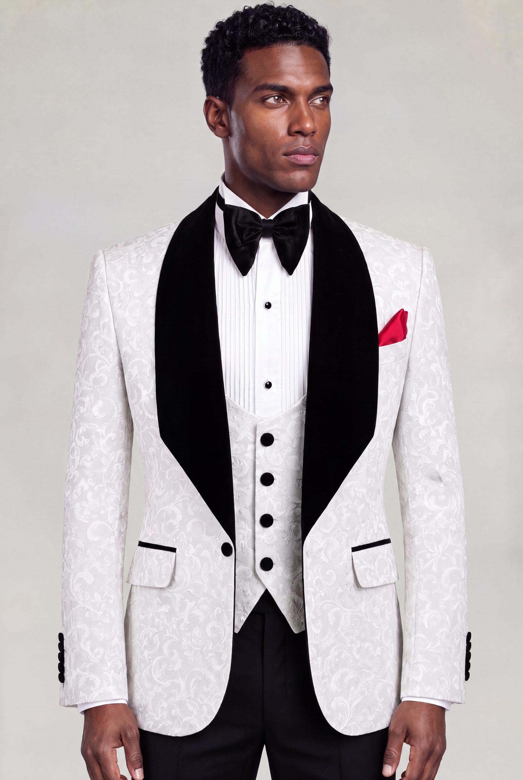 Three-quarter view of a white damask jacket and matching four-button vest with black trousers from Gentleman's Guru