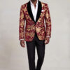 Burgundy and Gold Velvet Tuxedo Jacket full body walking with open collar white shirt and black trousers from Gentlemansguru.com