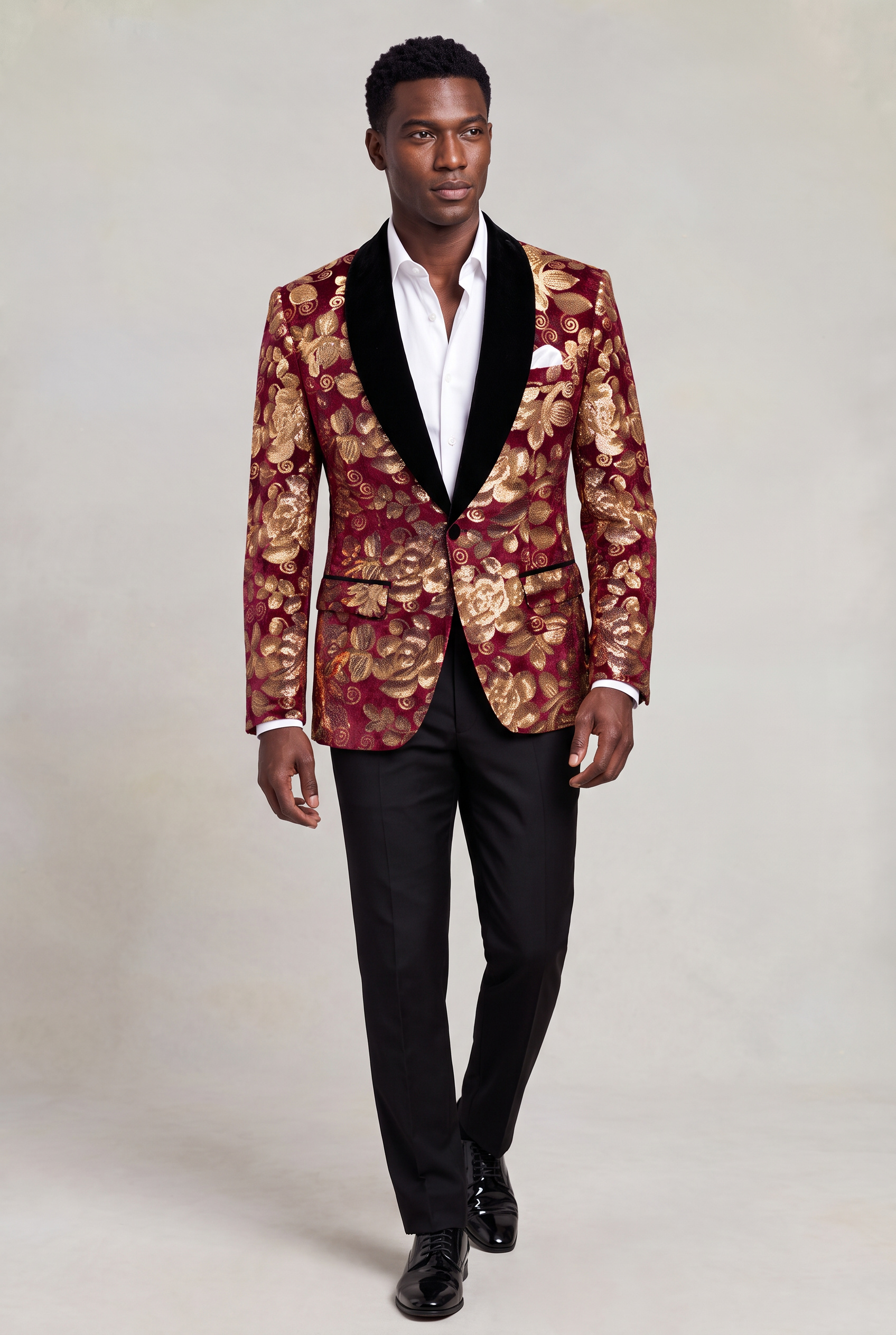 Burgundy and Gold Velvet Tuxedo Jacket full body walking with open collar white shirt and black trousers from Gentlemansguru.com