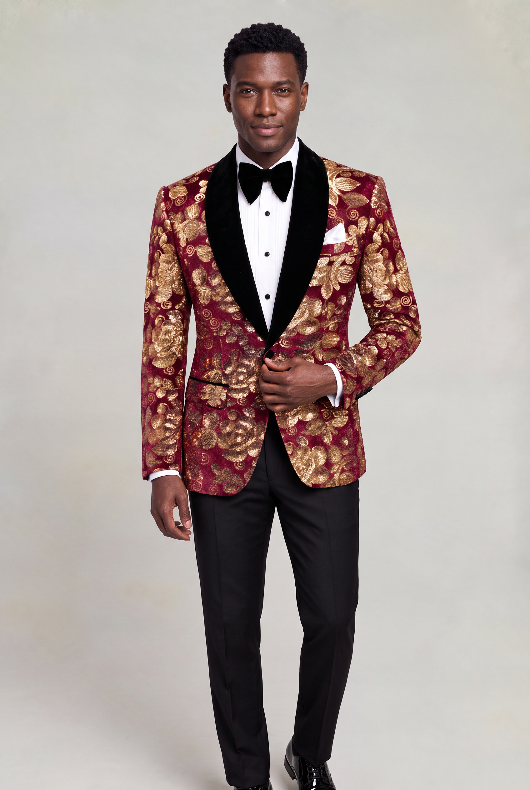 Burgundy and Gold Velvet Tuxedo Jacket front pose adjusting the single button from Gentlemansguru.com