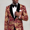 Burgundy and Gold Velvet Tuxedo Jacket three quarter pose holding the black shawl lapel from Gentlemansguru.com