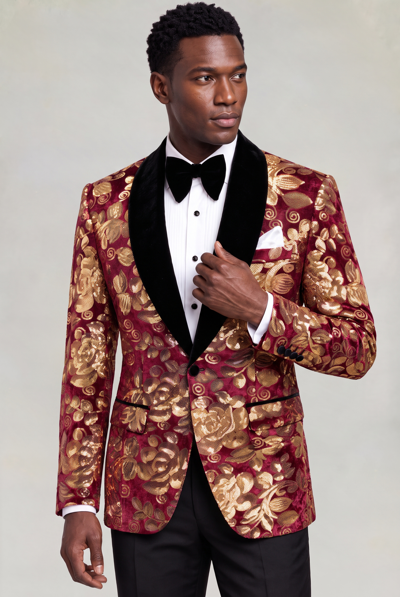 Burgundy and Gold Velvet Tuxedo Jacket three quarter pose holding the black shawl lapel from Gentlemansguru.com