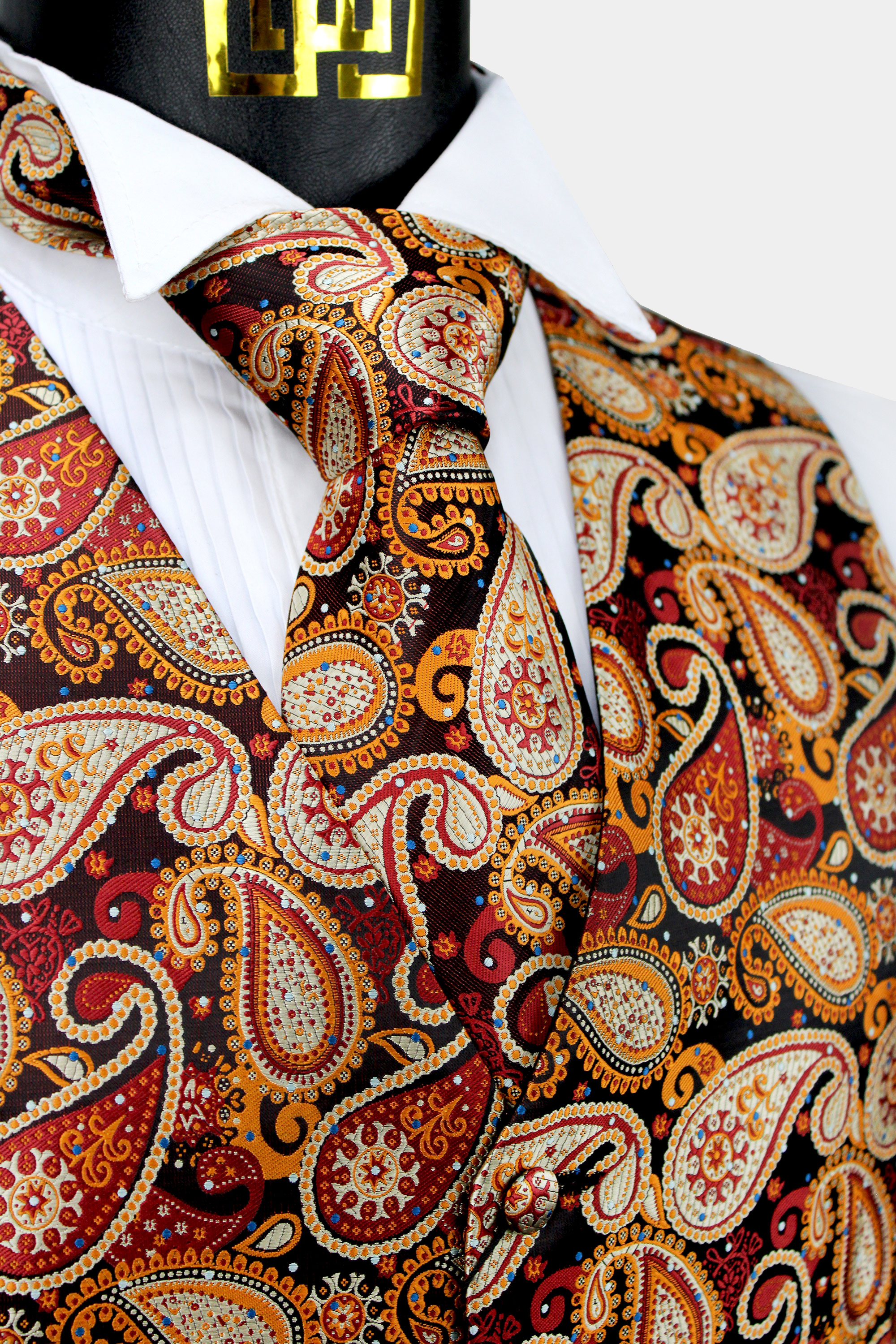 https://www.gentlemansguru.com/wp-content/uploads/2018/05/Burnt-Orange-Paisley-Groomsmen-Wedding-Vest-Tuxedo-WAistcoat-from-Gentlmemansguru.com_-1.jpg