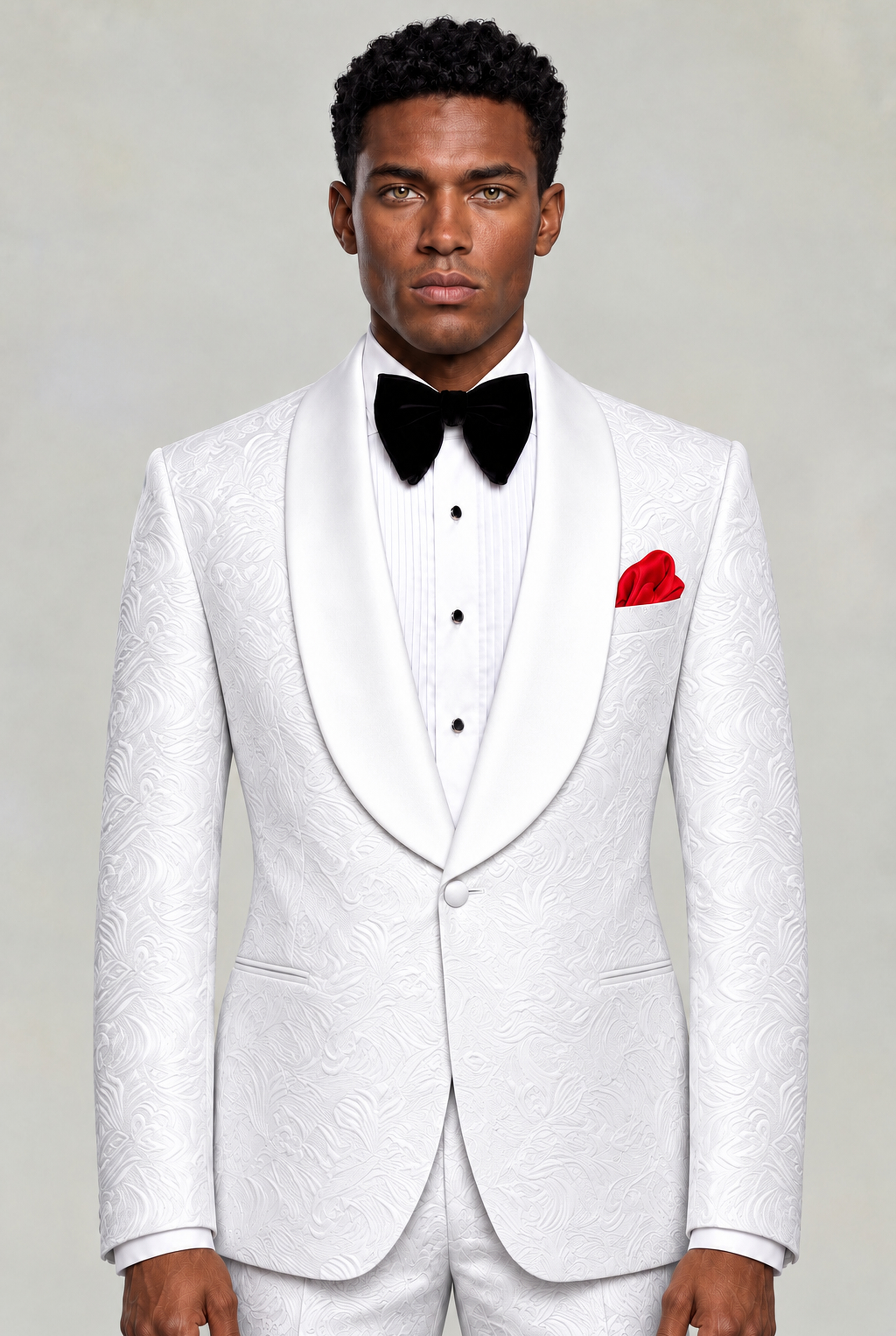 Front portrait of an all-white floral tuxedo with white shawl lapels and matching trousers from Gentleman's Guru