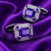 Purple crystal cufflinks displayed on royal silk from Gentlemansguru.com