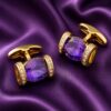 Purple and gold cufflinks as a groomsmen gift displayed on amethyst silk from Gentlemansguru.com