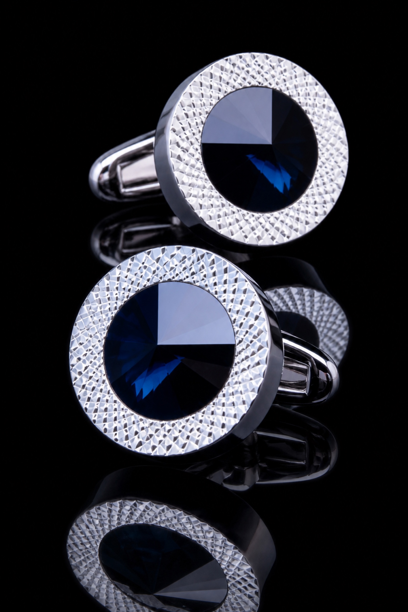 Round blue crystal cufflinks with textured silver rims for men