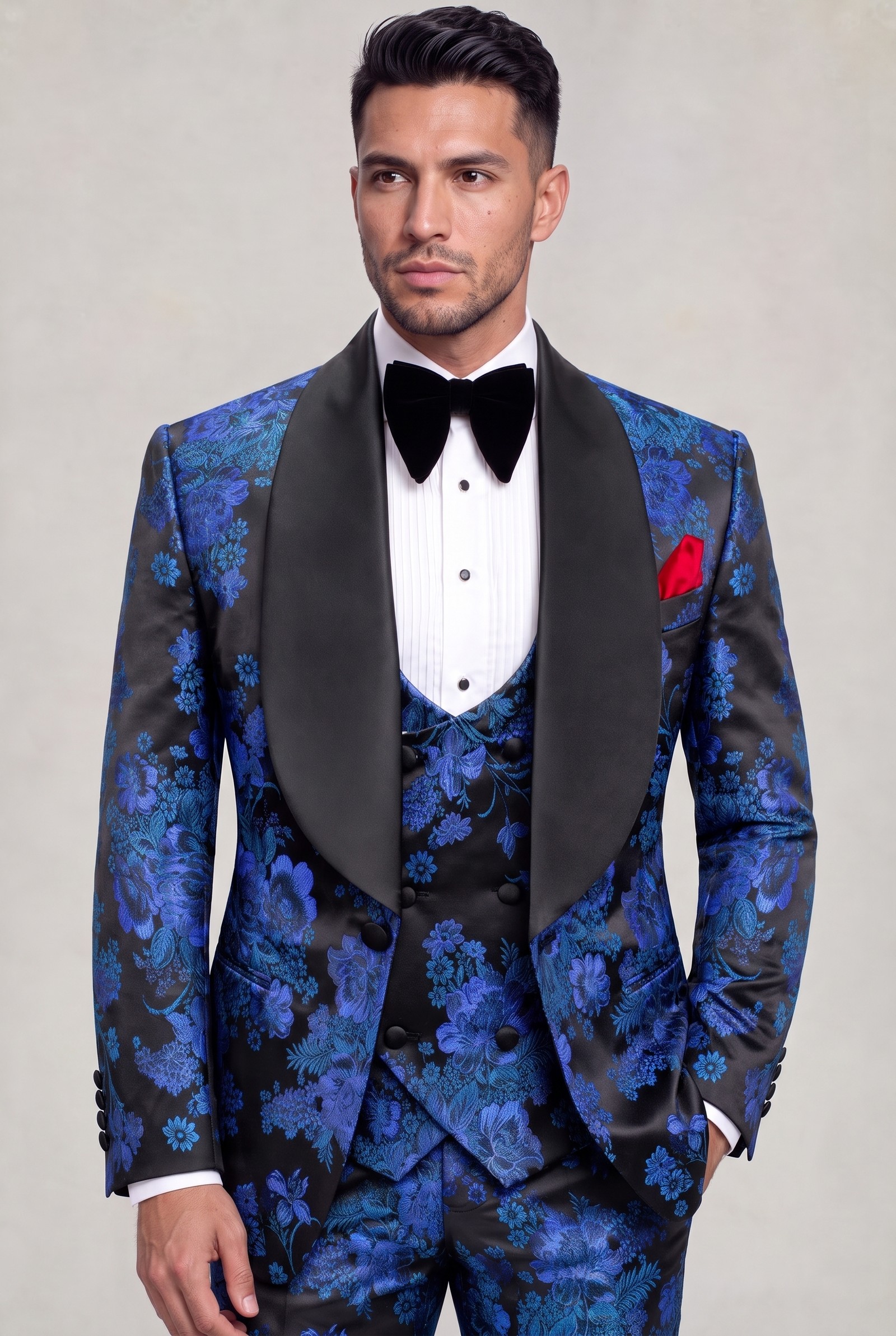 Royal blue and black floral groom tuxedo in a jacket-length portrait