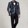 Floral tuxedo and plain trousers in a relaxed three-quarter pose