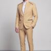Full-length champagne mandarin collar groom suit with matching beige trousers