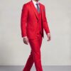 All-red three-piece suit in a natural side-walking pose