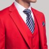 Close-up of red notch lapel, navy striped tie and matching pocket square