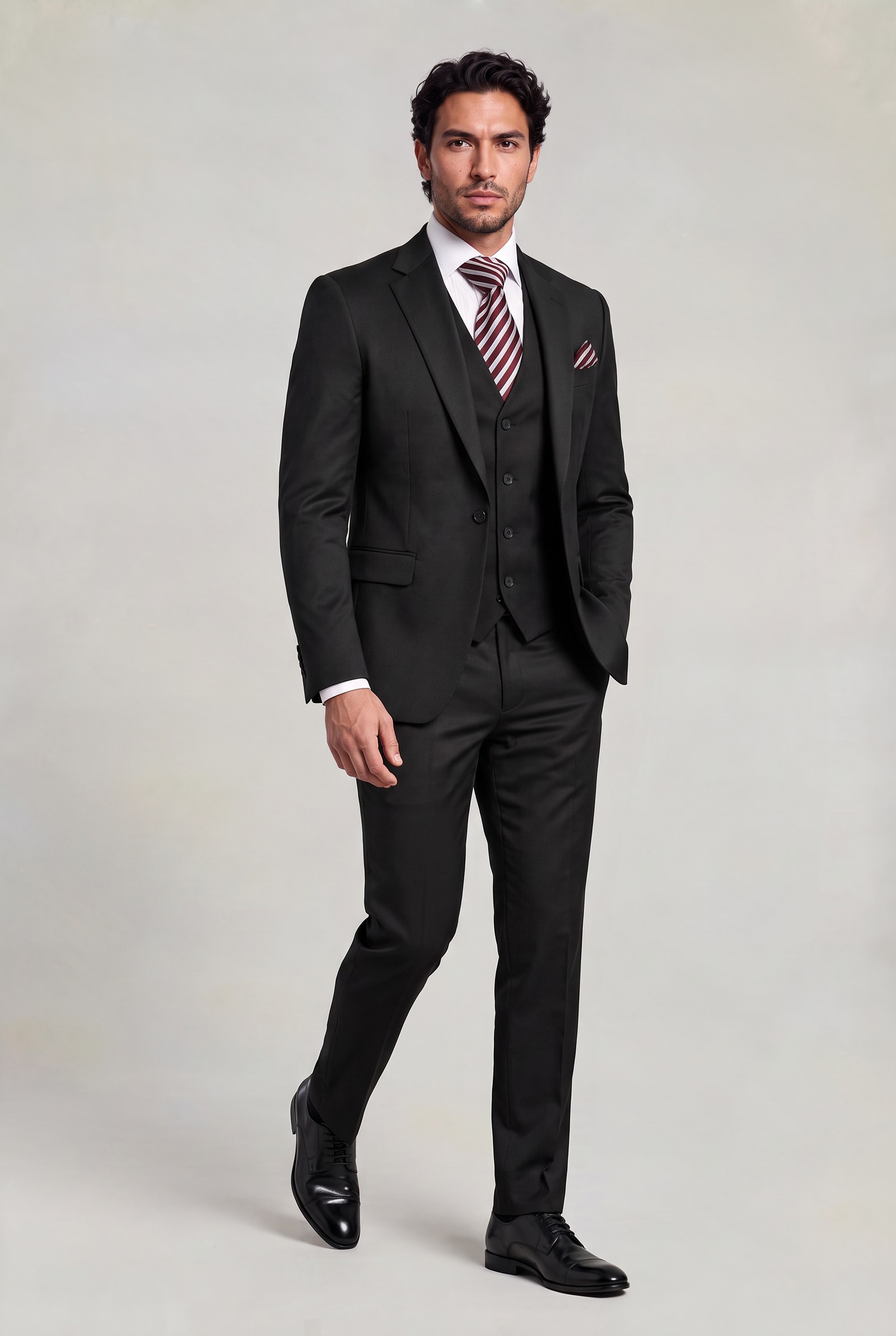 Full-length classic three-piece black suit with matching trousers and dress shoes