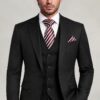 Classic three-piece black suit with notch lapels, four-button vest and striped tie