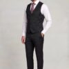 Full-length black vest and matching trousers with white shirt and striped tie