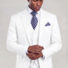 Model adjusting his cuff in a white suit with matching vest and navy striped tie from Gentleman's Guru