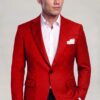 Red polka dot suit jacket and matching vest styled with black trousers