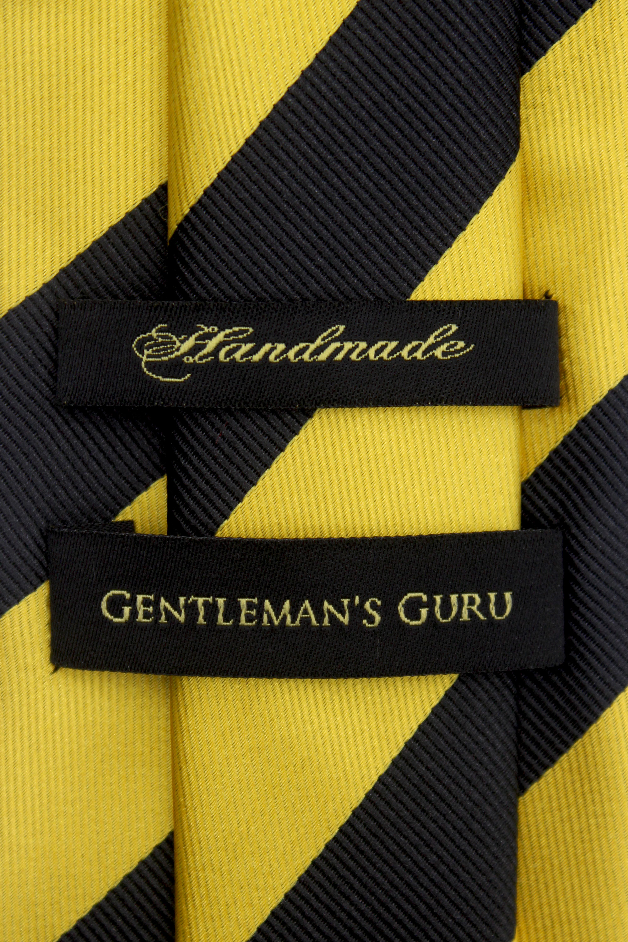 Black-and-Gold-Striped-Branded-Tie-from-Gentlemansguru.com