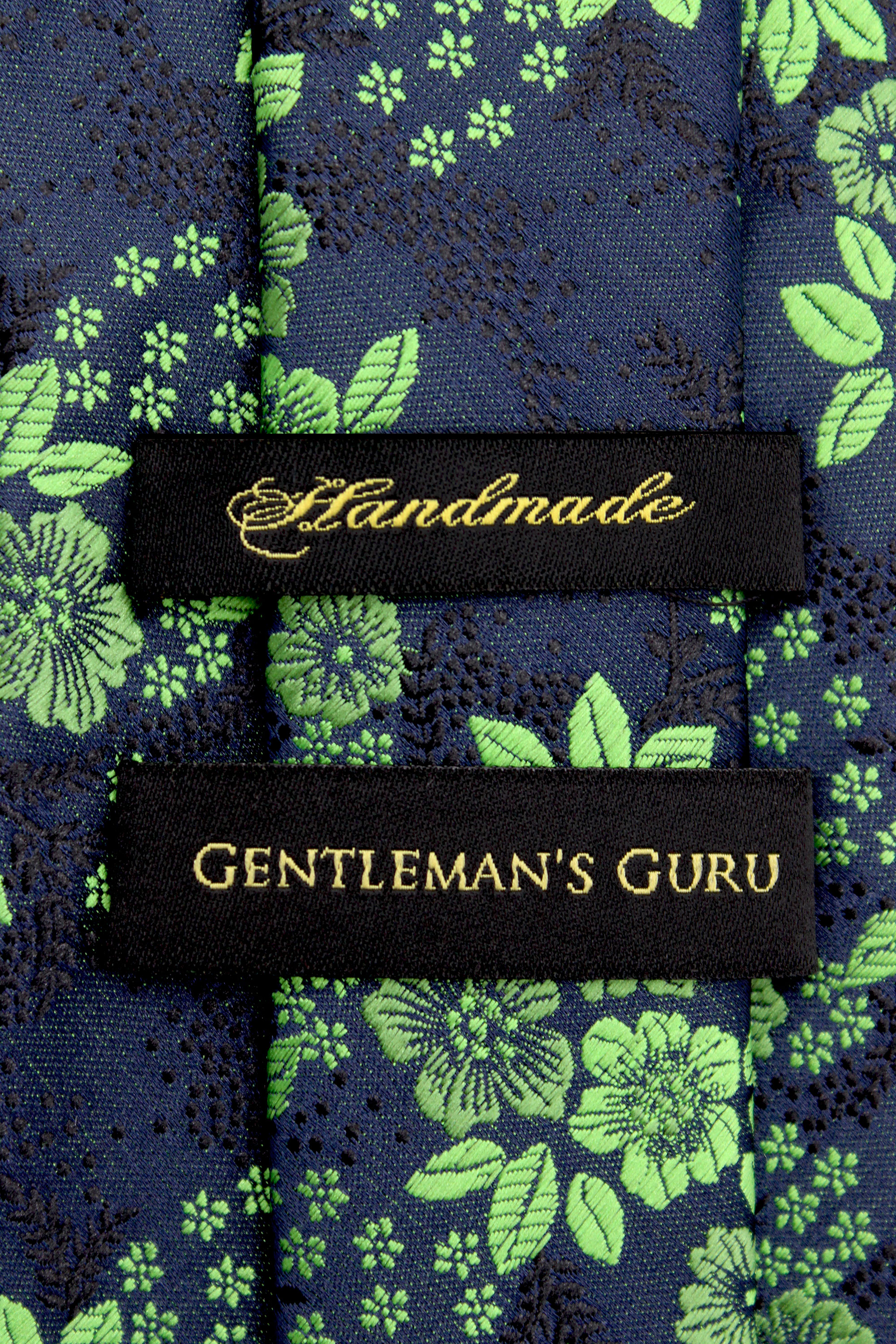 Green-Floral-Branded-Tie-from-Gentlemansguru.com
