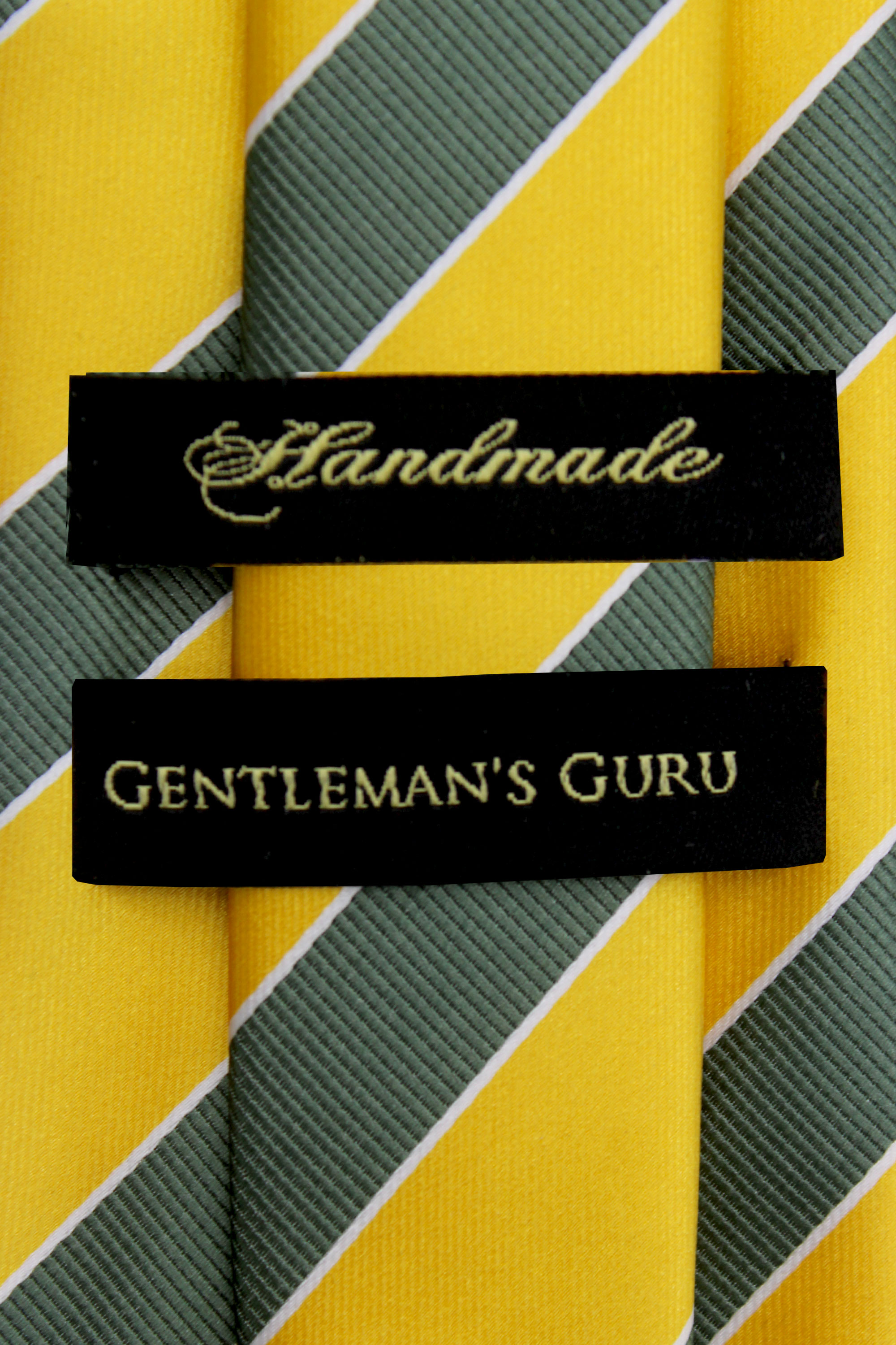 Green-and-Gold-Striped-Branded-Tie-from-Gentlemansguru.com
