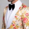 Close-up of white satin shawl lapel and peach floral tuxedo fabric