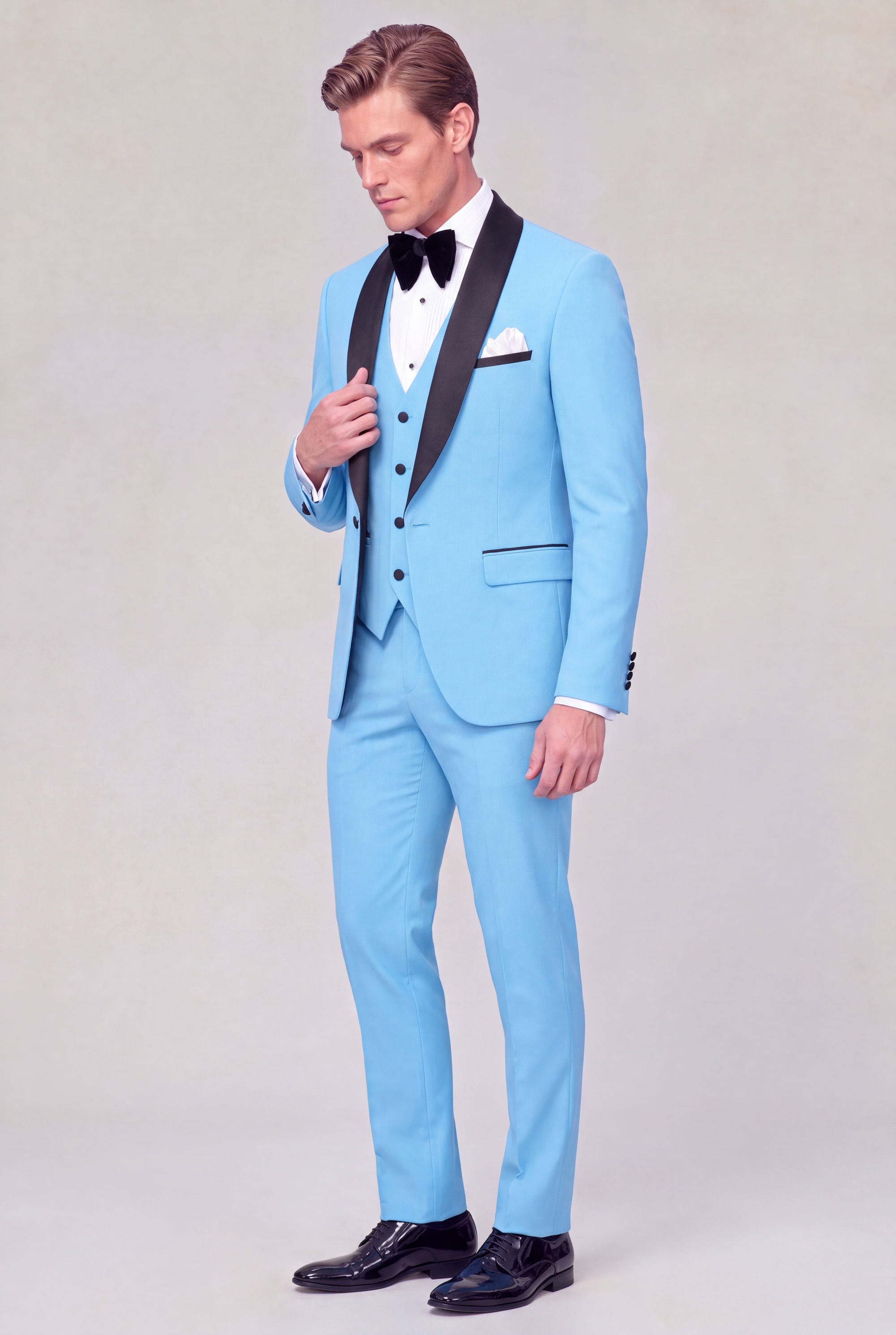 Full-length three-quarter view of a baby blue tuxedo with matching trousers