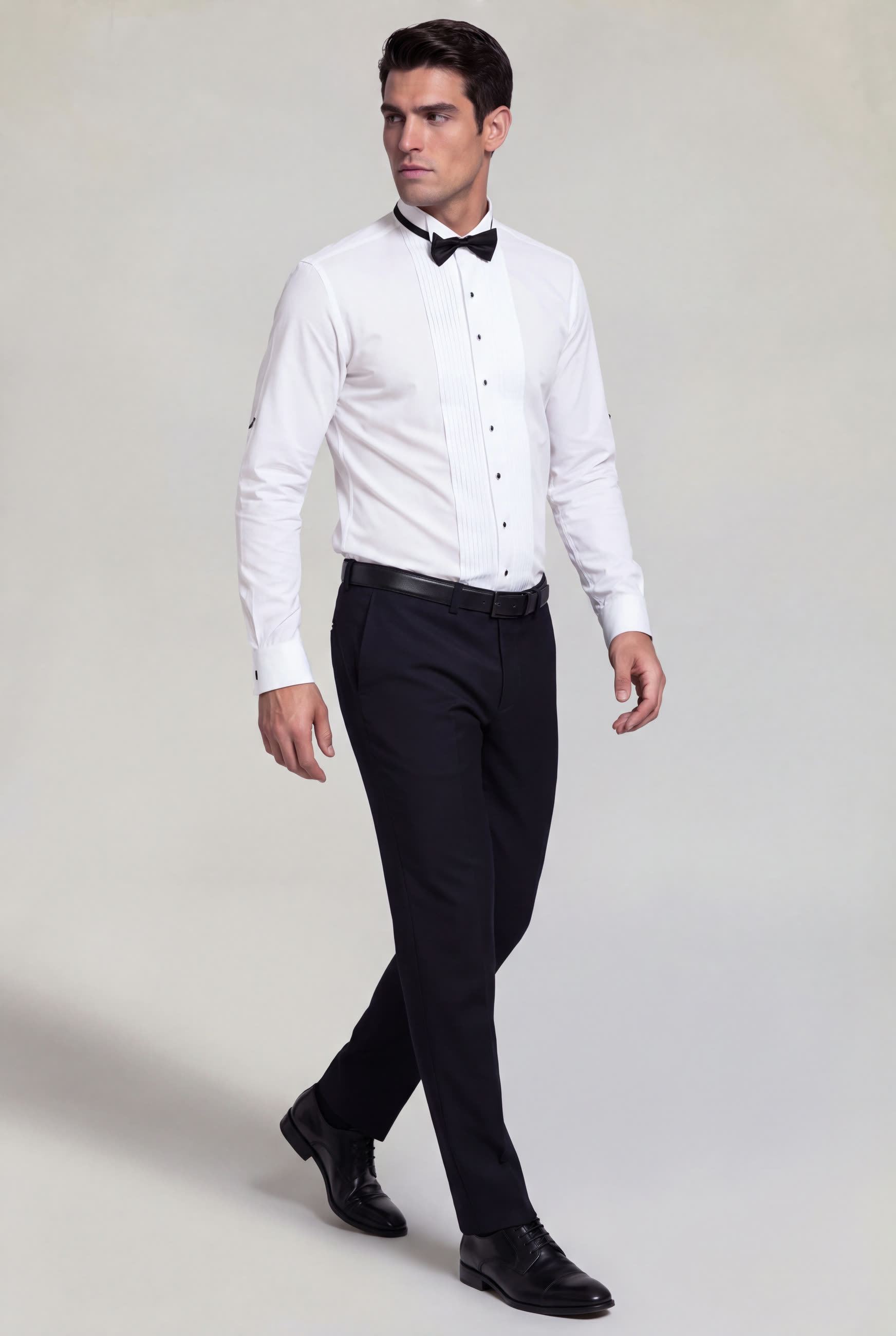 Men's white formal tuxedo shirt with black bow tie, black buttons and French cuffs for weddings and prom
