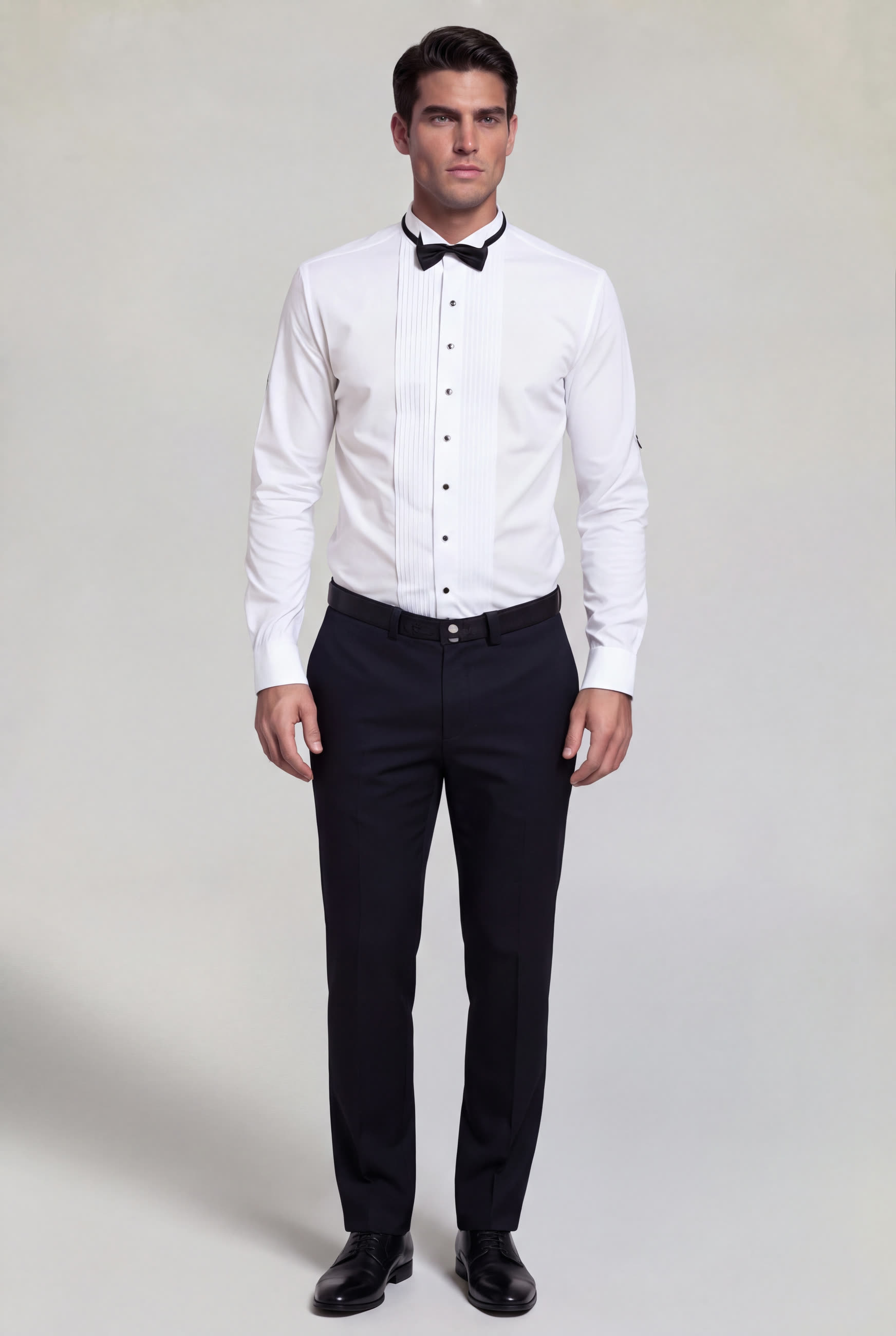 Men's white tuxedo shirt with black buttons, French cuffs and black dress pants for prom and weddings