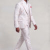 Side walking view of the ivory and rose gold tuxedo with matching patterned trousers and black shoes from Gentleman's Guru