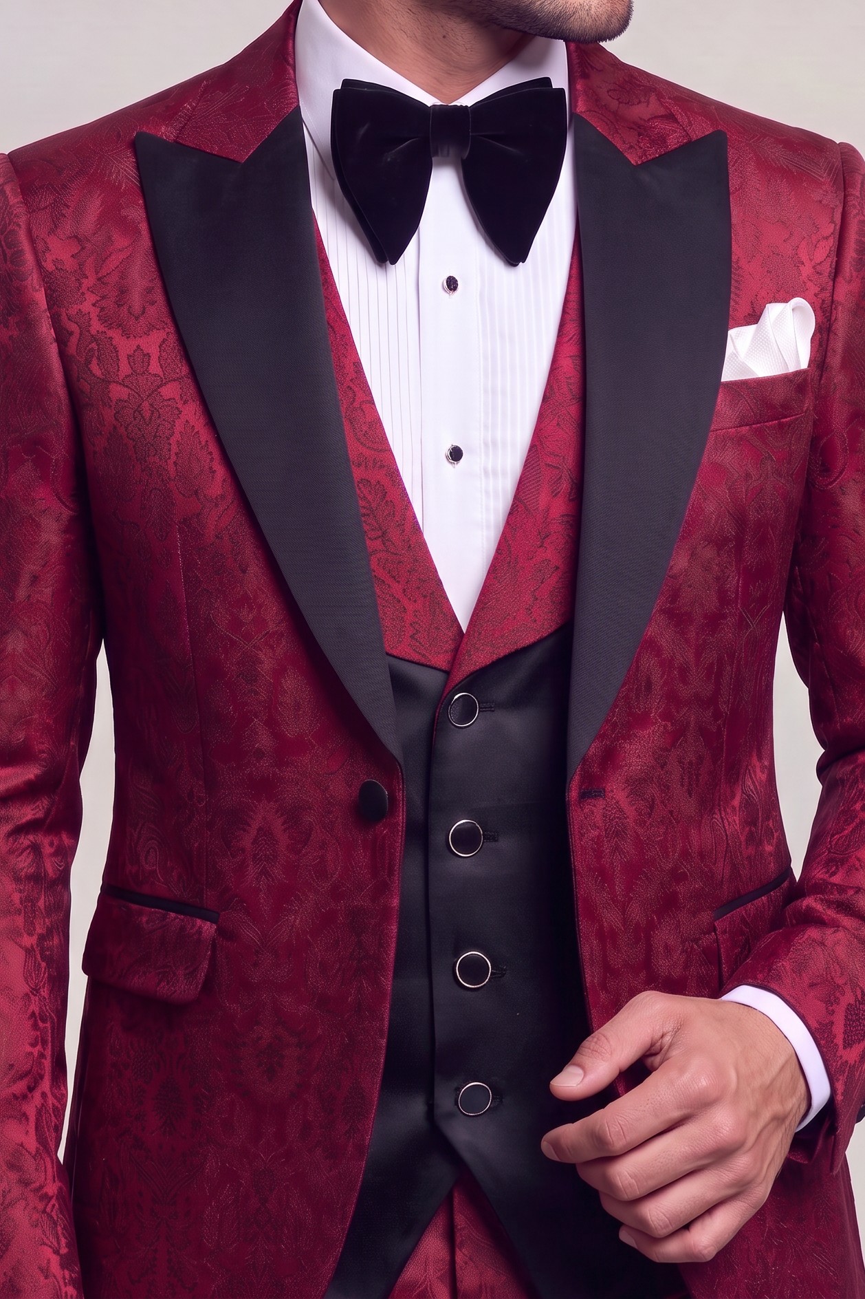 Burgundy damask tuxedo lapels, pocket square and contrasting waistcoat detail