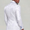 Back three-quarter view showing the white and silver floral jacket pattern with matching trousers from Gentleman's Guru