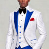 Three-quarter view of a white floral tuxedo jacket and vest paired with solid royal blue trousers from Gentleman's Guru
