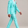 Full-length side profile of the turquoise floral suit while the model walks in dress shoes from Gentleman’s Guru