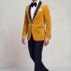 Asian male model walking in a gold velvet dinner blazer with black trousers