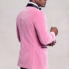 Back view of a men's light pink velvet tuxedo jacket on a model — Gentleman's Guru
