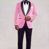 Full-body front view of a model in a men's light pink velvet tuxedo jacket and black pants — Gentleman's Guru