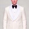Closed double breasted cream tuxedo jacket with white satin lapels and solid black trousers from Gentleman’s Guru