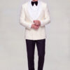 Full body cuff styling pose wearing a cream double breasted tuxedo jacket, black trousers and black dress shoes from Gentleman’s Guru
