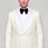 Front portrait showing the full cream tuxedo jacket, white satin shawl lapels and matching patterned trousers from Gentleman’s Guru