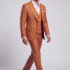 Burnt orange windowpane three-piece suit in a side-walking pose