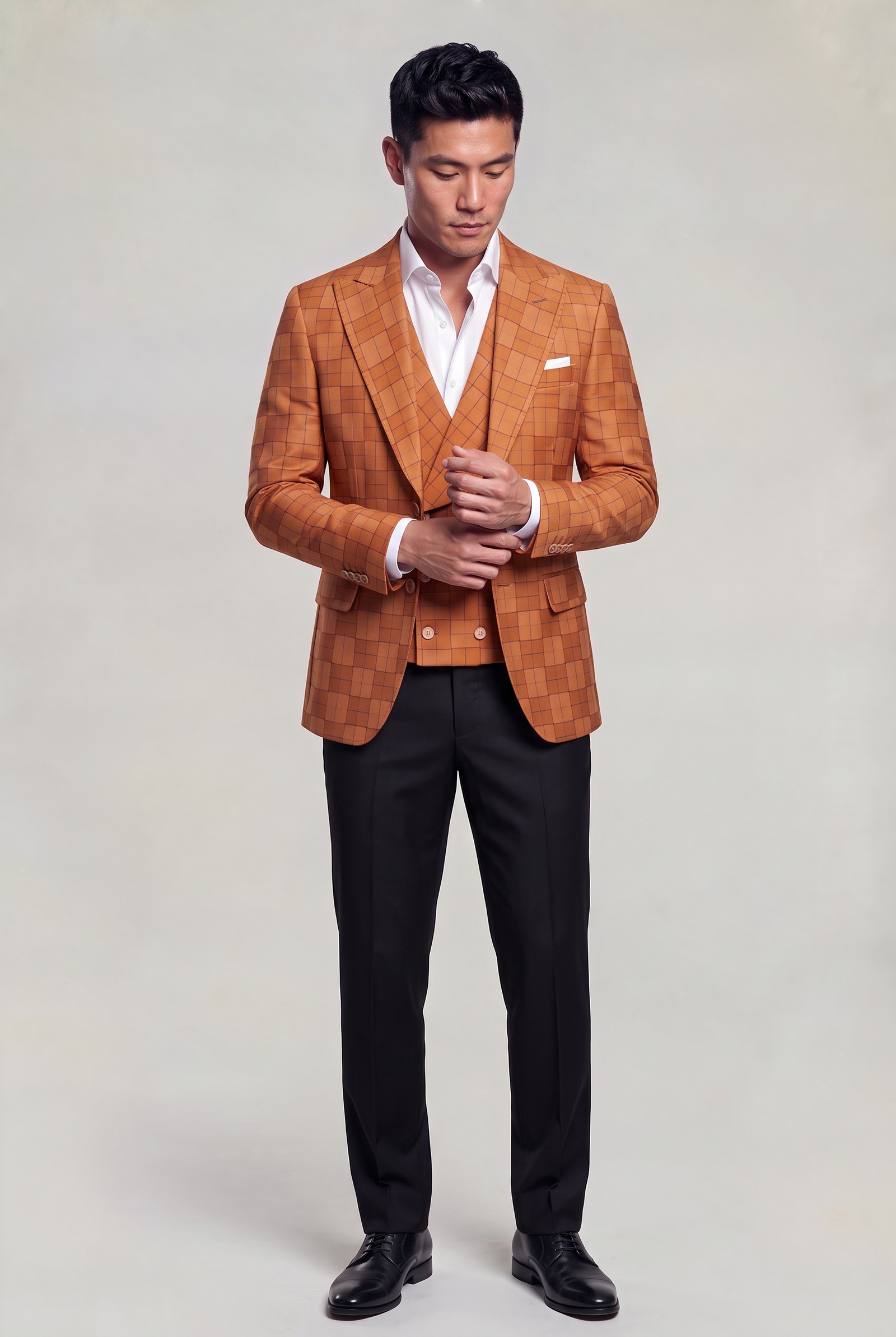 Full-body burnt orange windowpane jacket and vest with black dress trousers