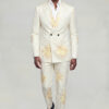 Full-length front walking view of a cream floral two piece suit with matching trousers and black dress shoes from Gentleman’s Guru