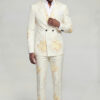 Full-body view of a model styling the peak lapel of a cream and pale yellow floral suit with matching pants from Gentleman’s Guru
