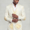 Model adjusting his cuff in a cream floral double breasted suit with pale yellow flowers and peak lapels from Gentleman’s Guru