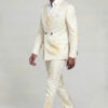 Side walking view showing the cream floral jacket, matching patterned trousers and black dress shoes from Gentleman’s Guru
