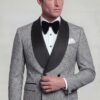 Grey houndstooth tuxedo jacket with two black front buttons and satin shawl lapels