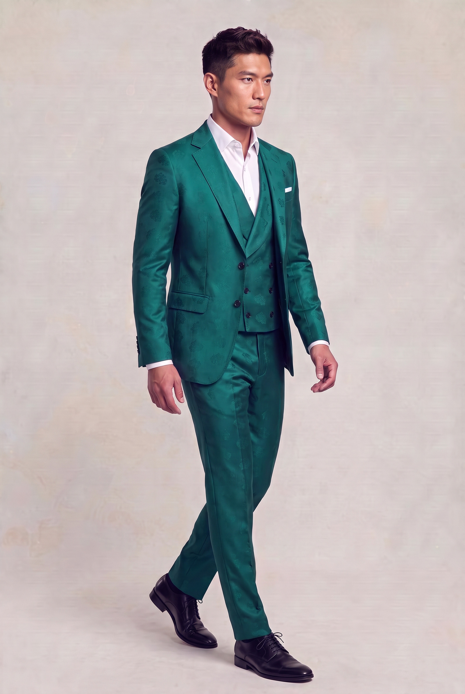 Full-length side walking view of a teal floral jacket, matching waistcoat and matching pants