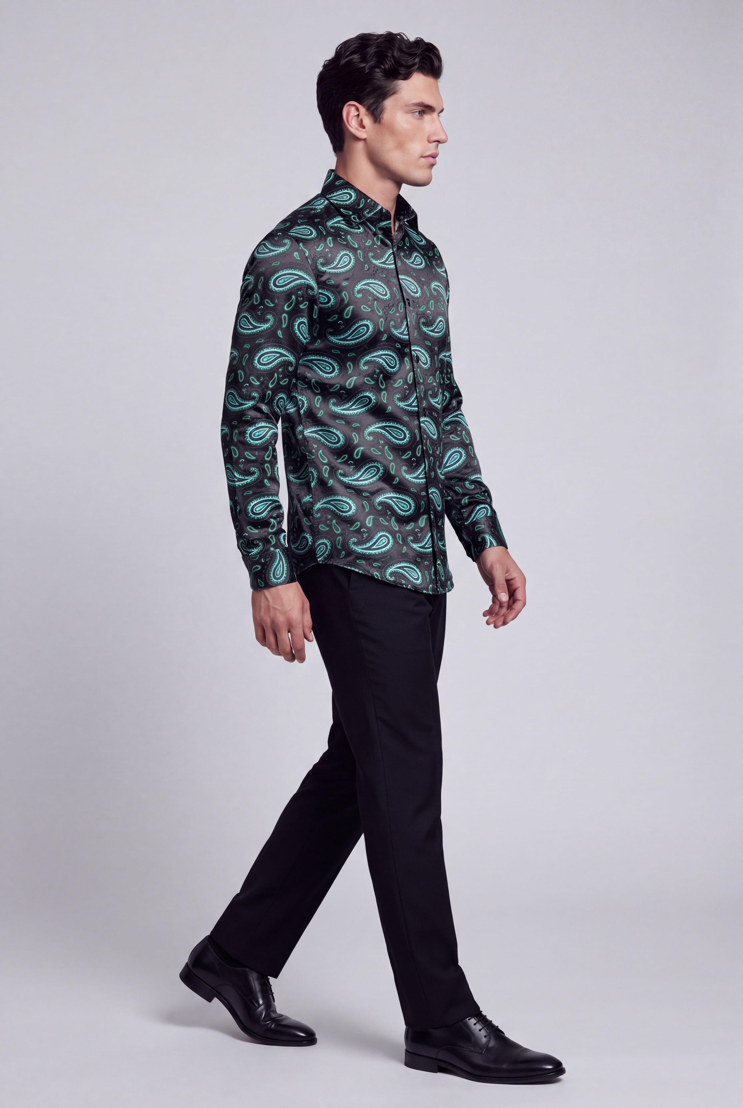 Men’s black and green paisley shirt full-body walking pose