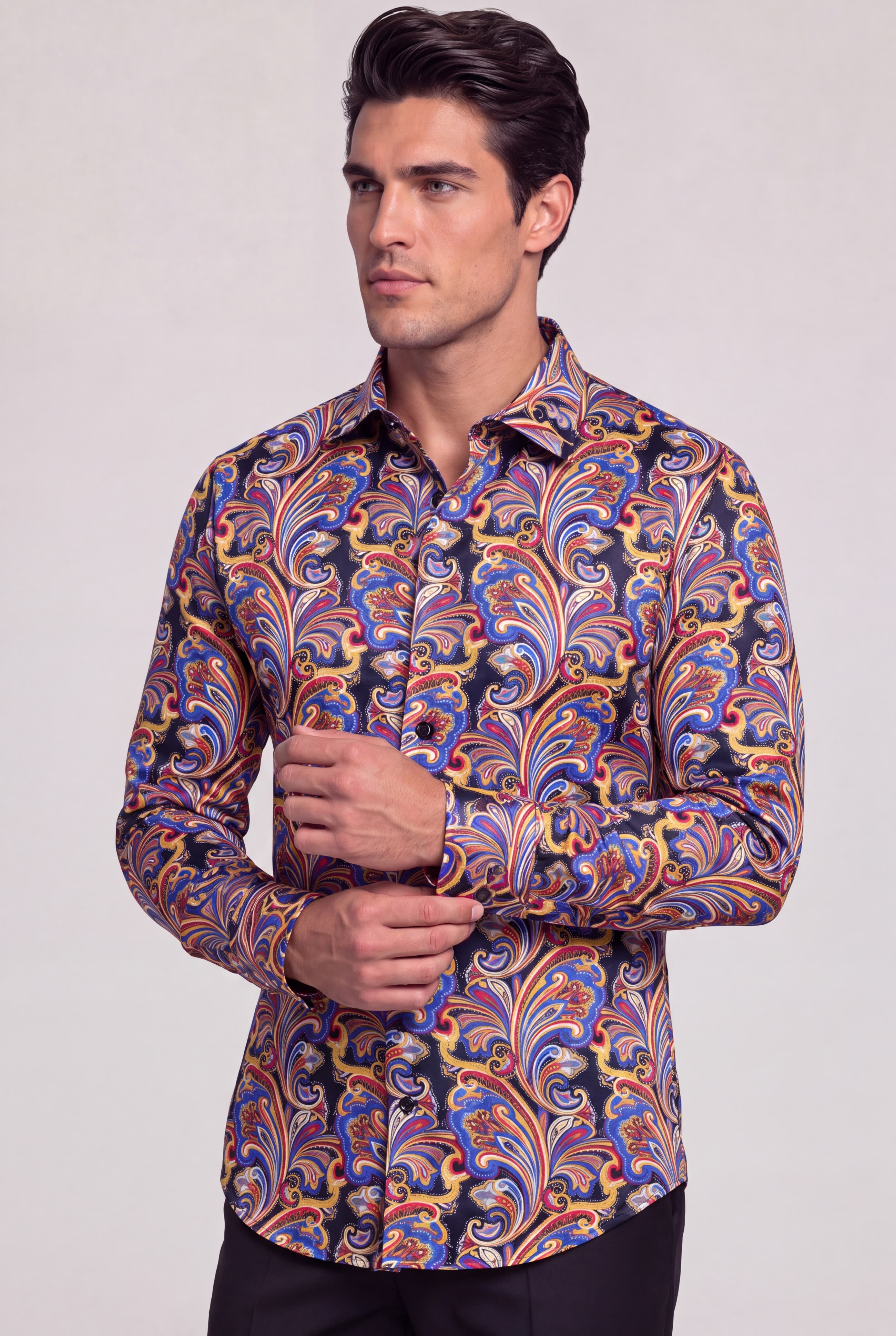 Men’s colorful paisley shirt with model adjusting the cuff